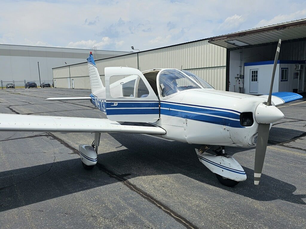 Piper Cherokee N9737W parked in front of the Azzurra hangar at Linden Airport